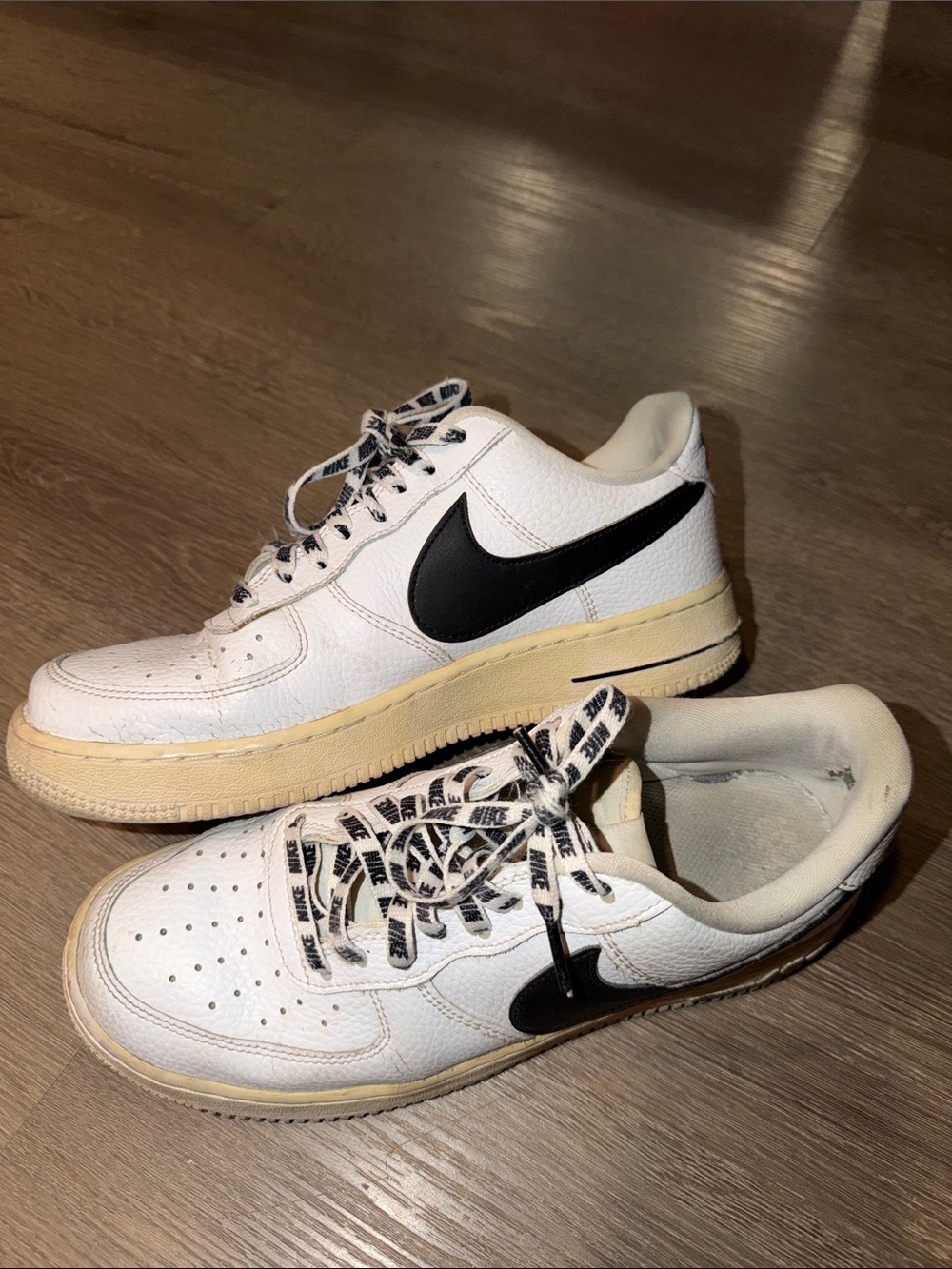 Nike White Sneakers with Black Swoosh and Cream Midsole